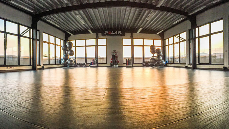 Open space for non-machine-based workouts with many windows for a nice view.